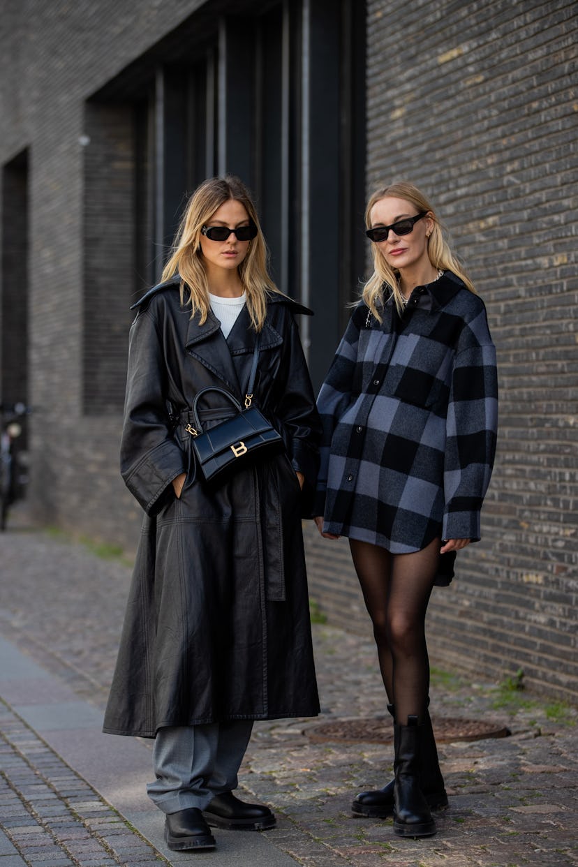 COPENHAGEN, DENMARK - AUGUST 12: Alessa Winter wearing grey pants, black coat, Balenciaga bag, Copen...