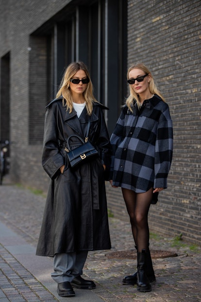 COPENHAGEN, DENMARK - AUGUST 12: Alessa Winter wearing grey pants, black coat, Balenciaga bag, Copen...