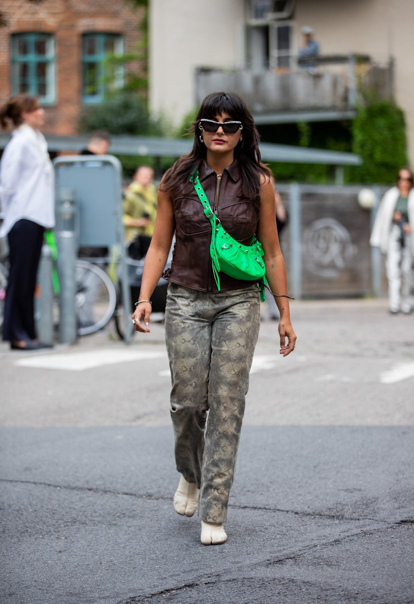 COPENHAGEN, DENMARK - AUGUST 09: Maria Bernad is seen wearing green bag, pants with snake print, bro...