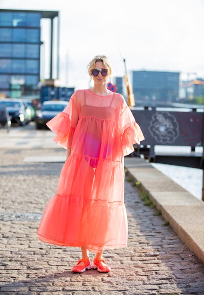 COPENHAGEN, DENMARK - AUGUST 10: A guest seen wearing pink sheer dress outside Rabens Saloner on Aug...
