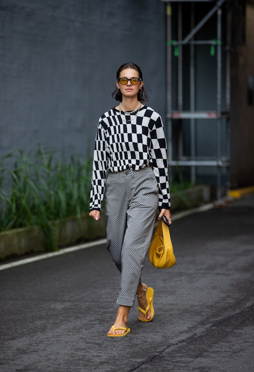 COPENHAGEN, DENMARK - AUGUST 10: Jacqueline Zelwis is seen wearing black white checkered jumper, gre...