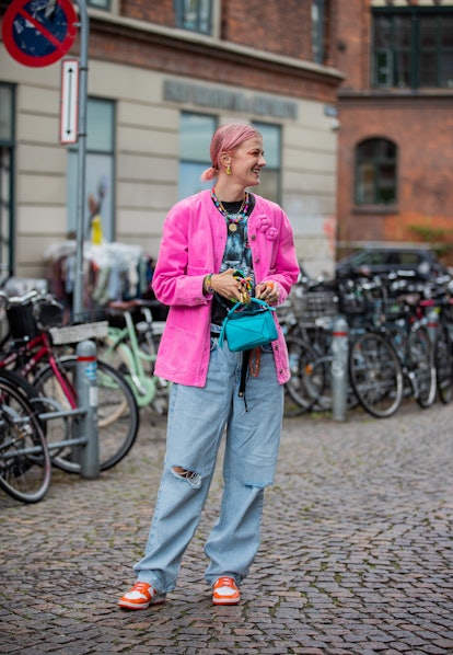COPENHAGEN, DENMARK - AUGUST 10: Marianne Theodorsen is seen wearing Loewe bag, pink jacket, ripped ...