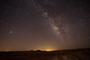 The Milky Way galaxy is pictured as a Perseid meteor streaks across the sky above the Negev desert n...
