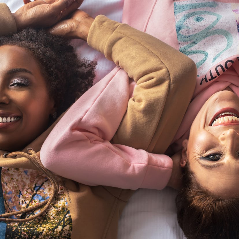 two friends smiling at camera questioning if their virgo libra friendship is compatible