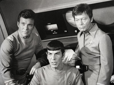 William Shatner, Leonard Nimoy, and DeForest Kelley appear together in the film Star Trek. Shatner p...