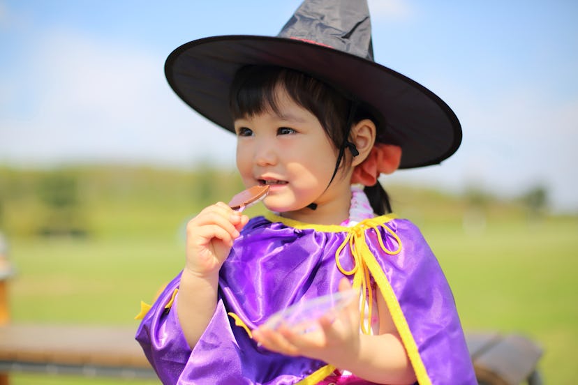 little girl dressed as witch