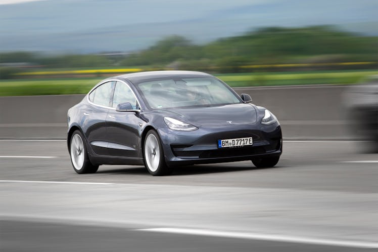 Diedenbergen, Germany - May 12, 2021: Tesla Model 3 on a highway nearby Wiesbaden in Germany. The Te...
