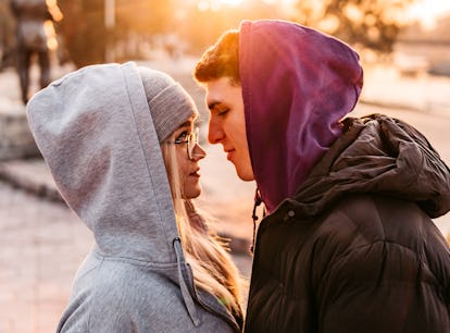 A couple with Virgo-Scorpio compatibility kiss. 