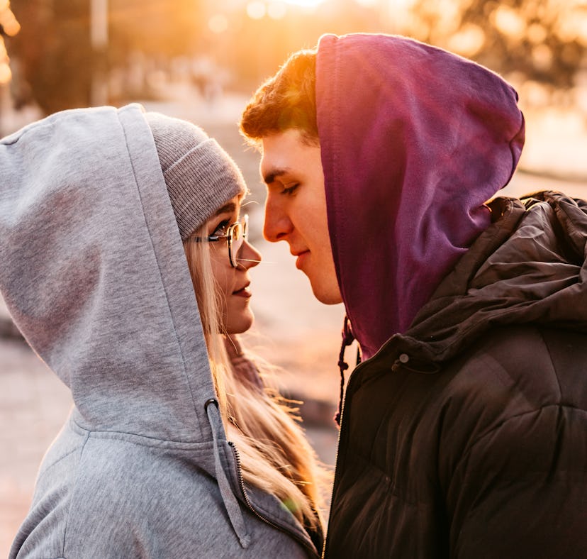 A couple with Virgo-Scorpio compatibility kiss.