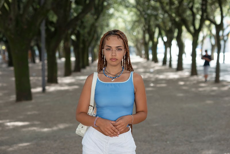 Portrait of a mixed race young woman with braided hair outdoor