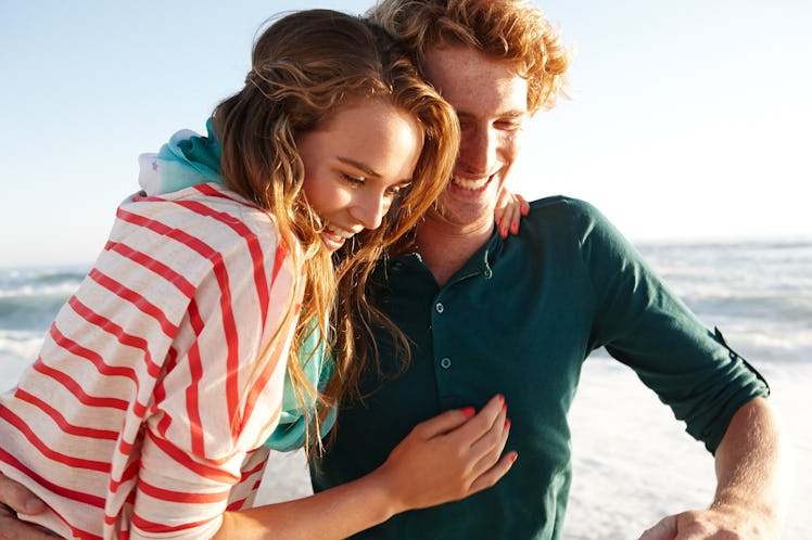 A couple with Virgo-Libra compatibility pose together.