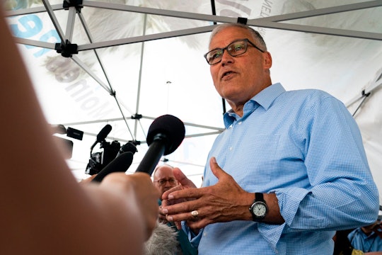 Democratic presidential candidate and Washington Governor Jay Inslee speaks with reporters at the Io...