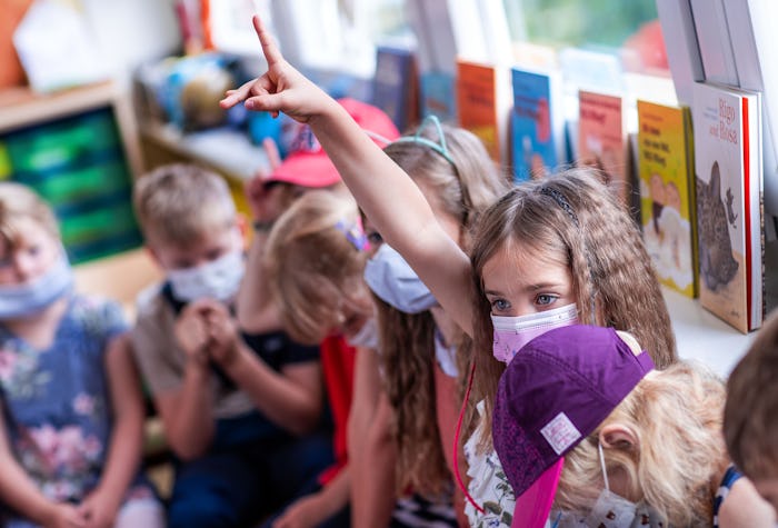 students wearing face masks in a classroom