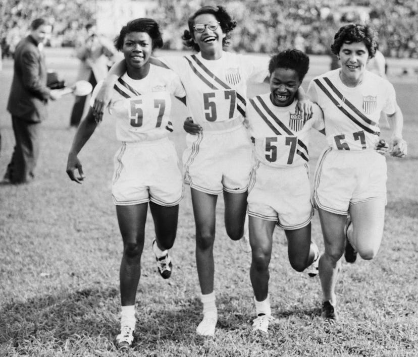 (Original Caption) 7/27/1952-Helsinki, Finland- Members of the U.S. Women's 400 meter relay team cav...