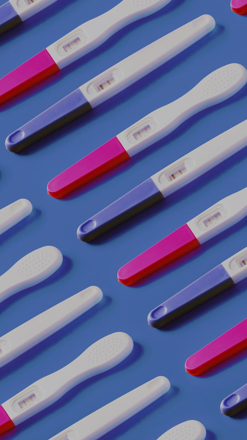 panoramic pattern with positive pregnancy tests over blue background