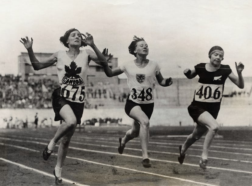 (Original Caption) The finish of the eight heat of the 100-meter dash for women won by Myrtle Cook (...