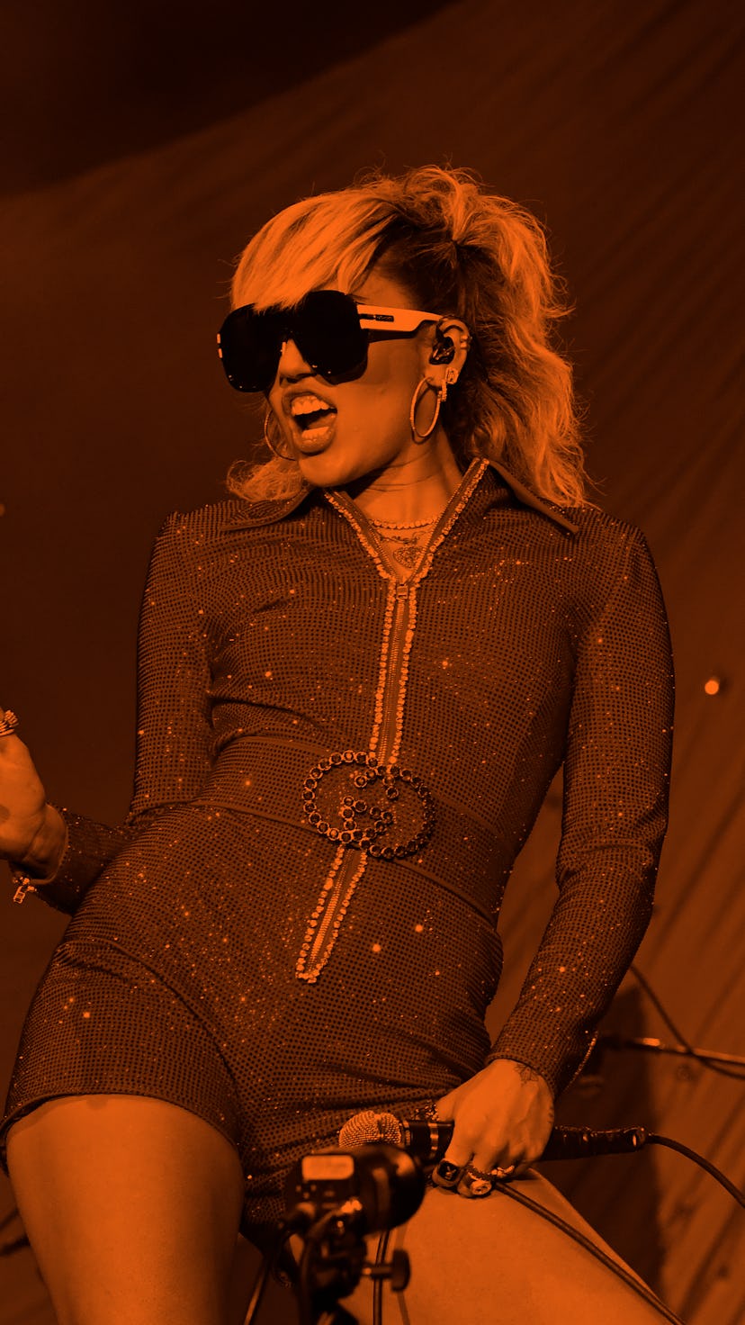 CHICAGO, ILLINOIS - JULY 29: Miley Cyrus and Billy Idol perform on stage during Lollapalooza 2021 at...