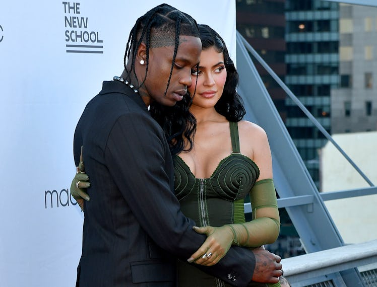 Kylie Jenner and Travis Scott on a red carpet. 