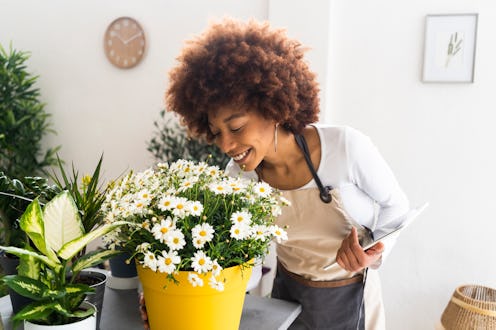woman smelling flowers