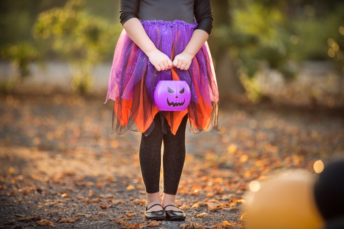 kid dressed as witch for halloween