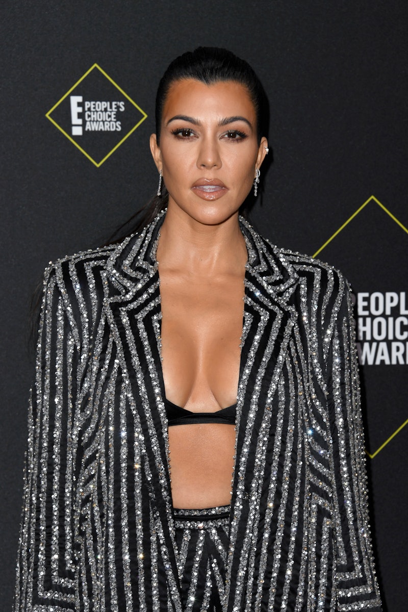 Kourtney Kardashian's stretch comb headband proves that she's the master of 1990s hair trends. After...