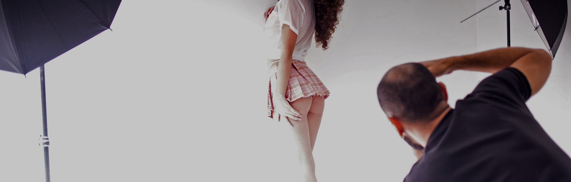 Valery Lopez poses for pictures with photographer Michael Davis (R) during a photoshoot to make cont...