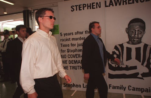 Three of the suspects tried in the Stephen Lawrence murder case walk past a Stephen Lawrence Family ...
