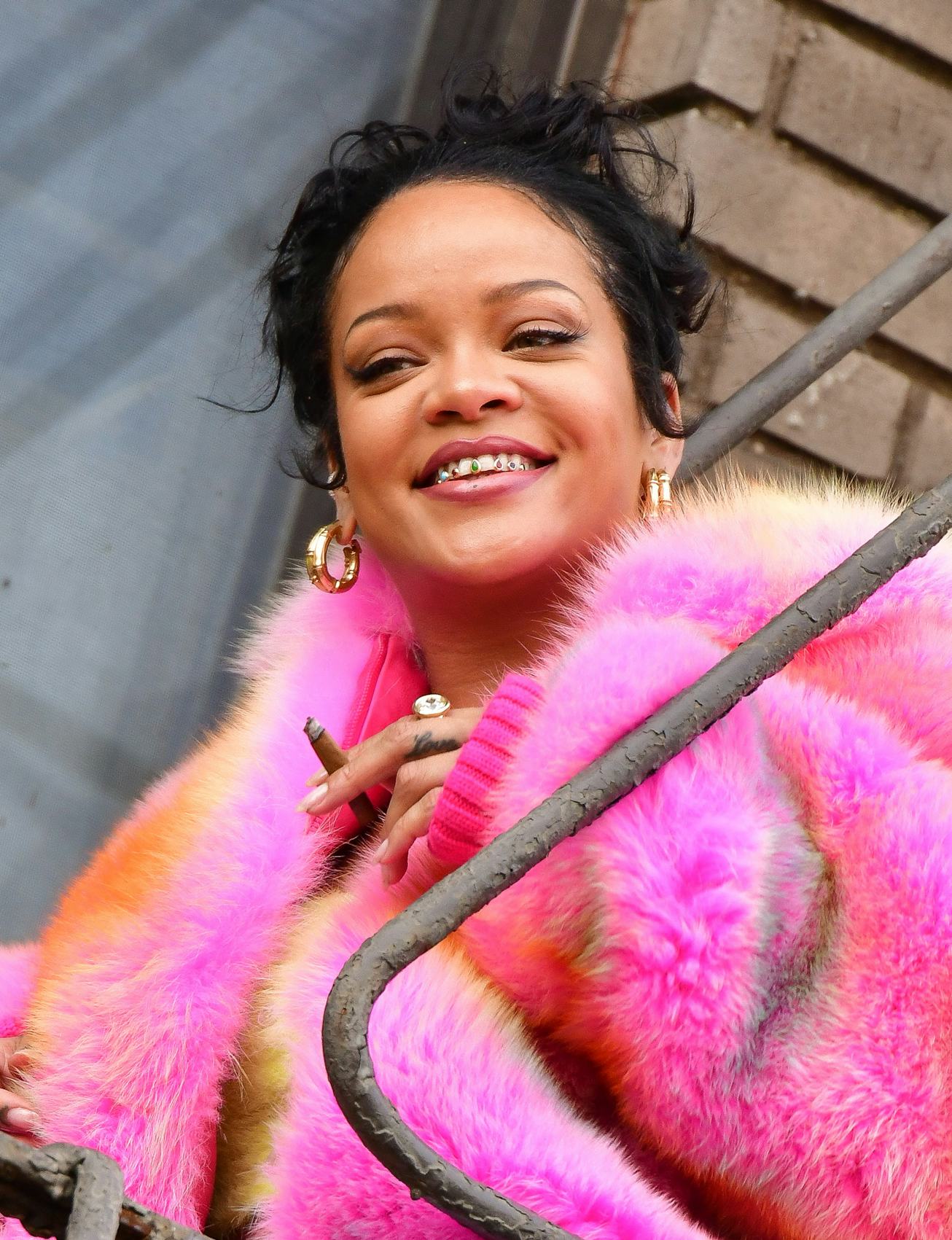 Rihanna wearing tooth gems