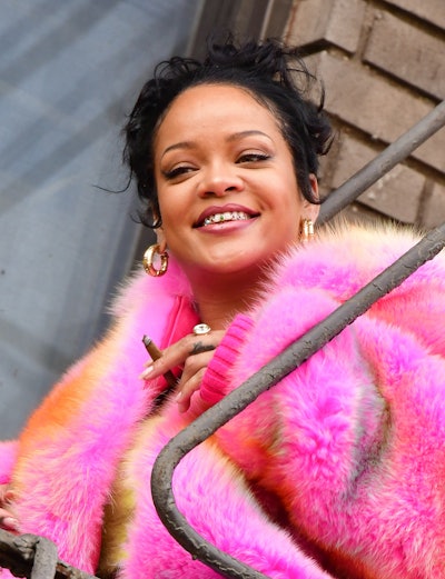 Rihanna wearing tooth gems
