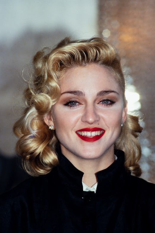 Madonna in a signature red lipstick in the '80s. 