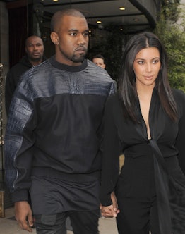 LONDON, ENGLAND - MAY 22: Kim Kardashian and her boyfriend Kanye West leave their hotel on May 22, 2...
