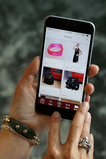 Poshmark co-founder Tracy Sun shows her app at her office in Redwood City, California, on friday, ma...