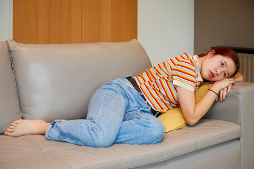 woman laying on the couch