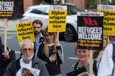 LONDON, UNITED KINGDOM - AUGUST 23, 2021: Demonstrators including Afghan people protest outside the ...