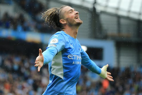 MANCHESTER, ENGLAND - AUGUST 21: Jack Grealish of Manchester City celebrates after scoring their sid...