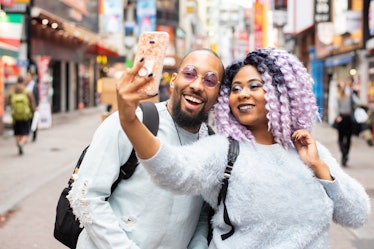 A Virgo woman and Scorpio man take a selfie. 