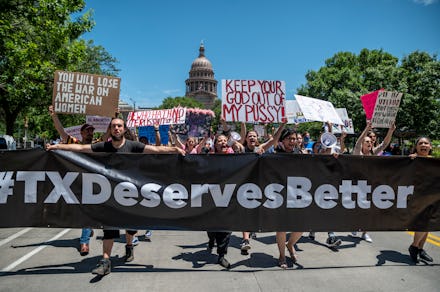 AUSTIN, TX - MAY 29: Pro choice protesters march down Congress Avenue at a protest outside the Texas...