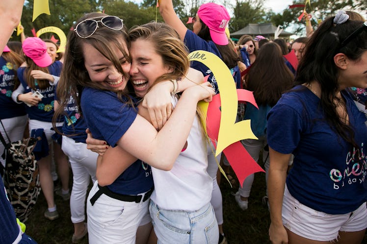 Members of Chi Omega sorority hug on Bid Day, which is a cute moment that should be shared on Instag...