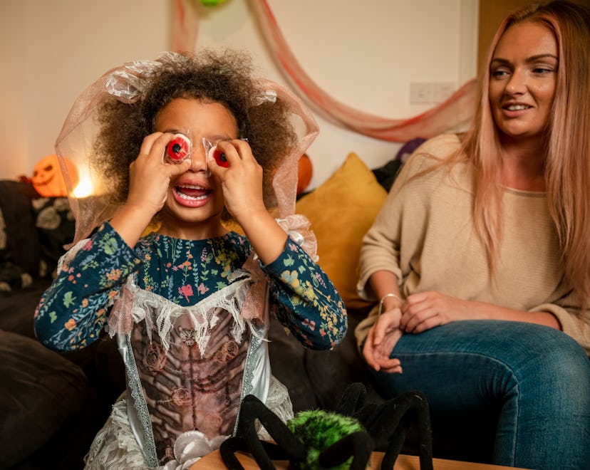a little girl being silly on halloween, halloween jokes and riddles