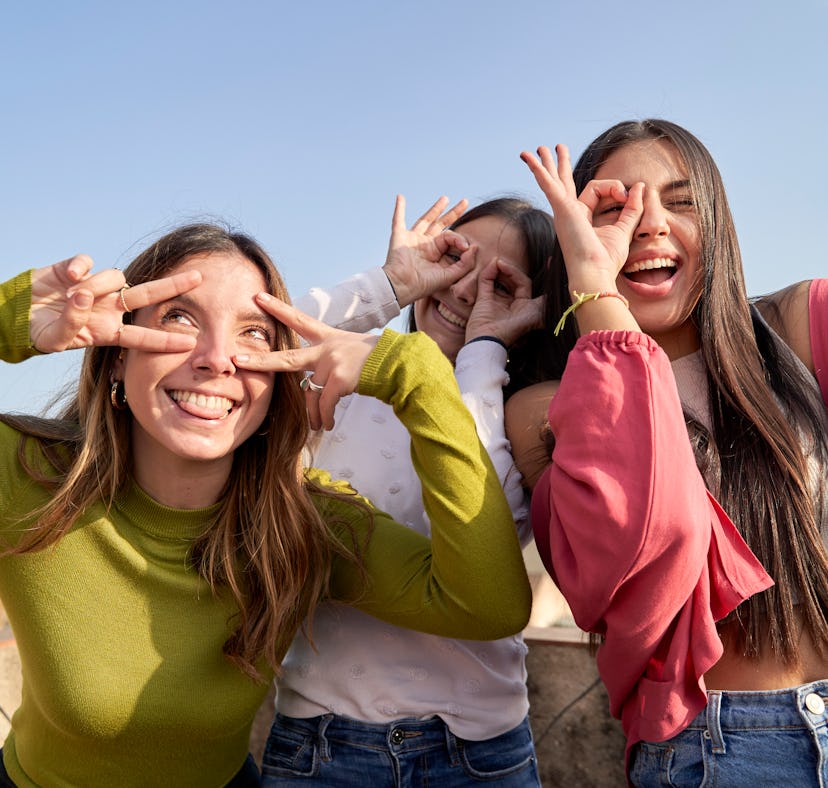 A group of friends celebrate on Bid Day with a selfie they can post on Instagram with sorority capti...