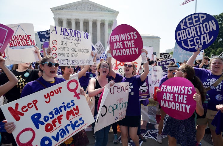 Abortion rights activists cheer after the US Supreme Court struck down a Texas law placing restricti...