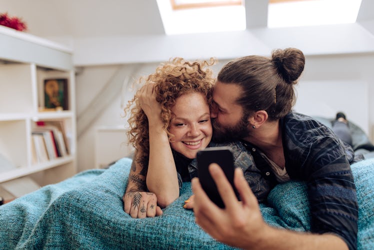 Young couple posting IG caption for their four-month anniversary.