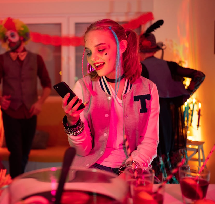 A woman thinks of sexy texts to send on Halloween.