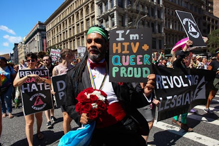 NEW YORK, NY - JUNE 30: An activists holds a sign in support of sufferers of HIV during the Queer L...