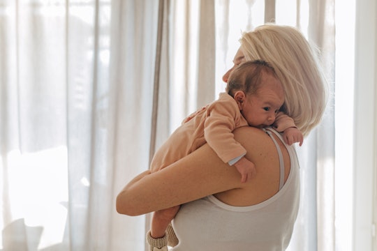 The best breastfeeding positions for babies with reflux include gravity's help.