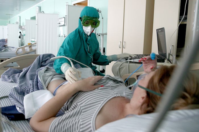 KAZAN, RUSSIA AUGUST 5, 2021: Performing an ultrasound scan in a temporary obstetric facility for C...