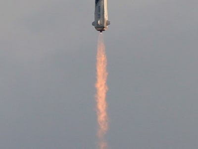 VAN HORN, TEXAS - JULY 20:  The New Shepard Blue Origin rocket lifts-off from the launch pad carryin...