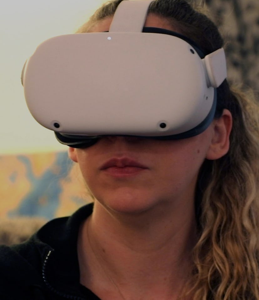 Amy Erdt, a community leader in the virtual reality space, sits in her living room and travels to fo...