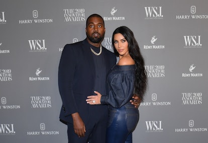 US media personality Kim Kardashian West (R) and husband US rapper Kanye West attend the WSJ Magazin...