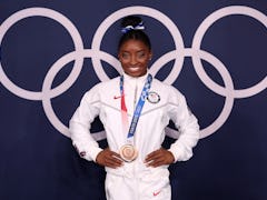 TOKYO, JAPAN - AUGUST 03: Simone Biles of Team United States poses with the bronze medal following t...